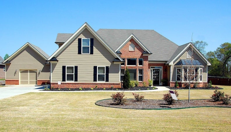 large house with brick and vinyl siding