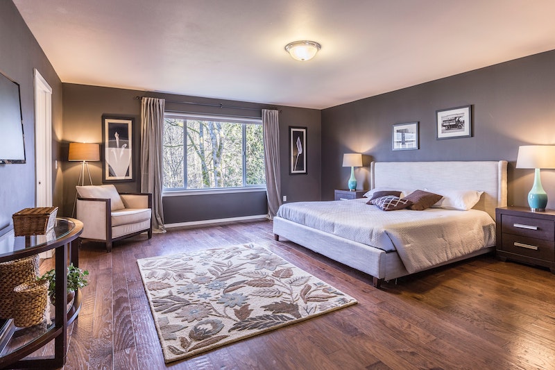 bedroom with long thermal curtains