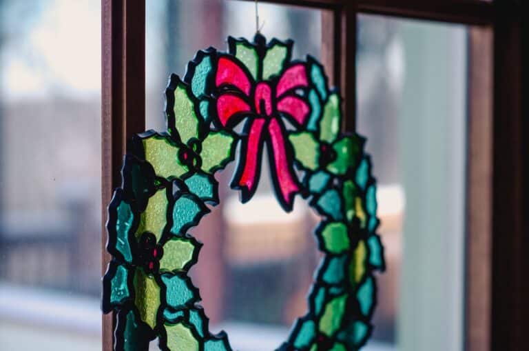 winter holiday stained glass wreath in window